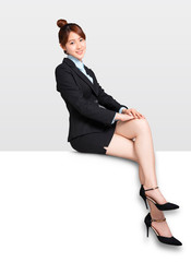 young Businesswoman sitting on blank billboard placard sign