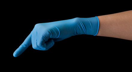 Doctor's hand in medical gloves touching screen by finger isolated on black