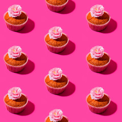 Stylized image of a cupcake and sakura flower as a pattern