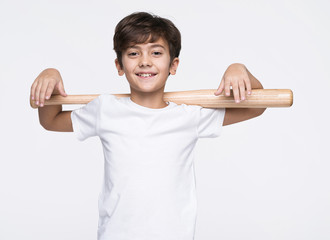 Smiling boy holding baseball bat