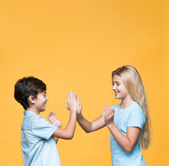 Young sibling playing with copy-space
