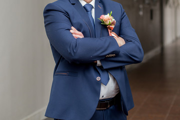 groom in a wedding suit alone