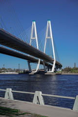 Cable-stayed road bridge against the blue sky, beautiful engineering solutions