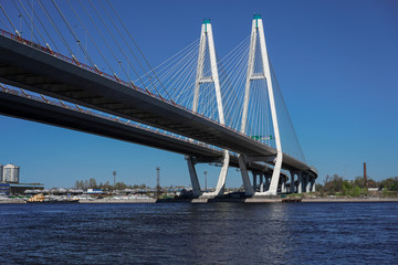 Cable-stayed road bridge against the blue sky, beautiful engineering solutions