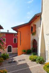 colorful houses in gardone riviera village in italy 