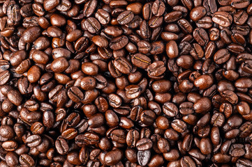 Fototapeta premium Piled roasting coffee beans backgrounds. Top view