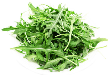 fresh arugula leaves on a white background