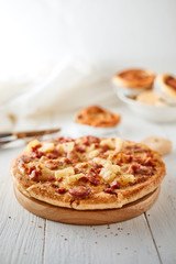 Pizza with bacon and sausage.