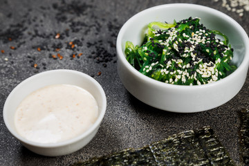 Chuk seaweed salad and sesame seeds. Chinese cuisine.