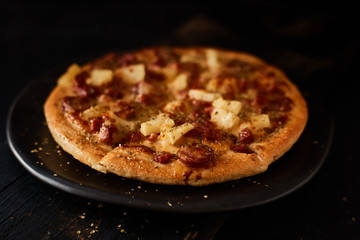 Pizza with bacon and sausage.