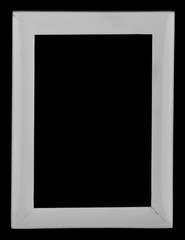 White photo frame isolated on a black background close-up.