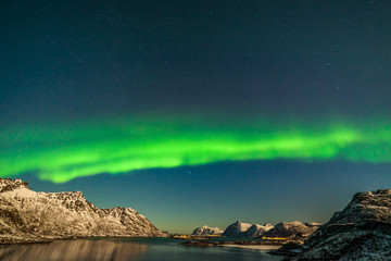 Fototapeta na wymiar Dramatic polar lights, Aurora borealis over the mountains in the North of Europe - Lofoten islands, Nature of Norway
