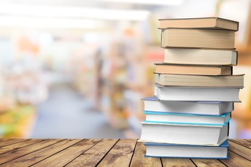 Stack of old study books on the wooden desk