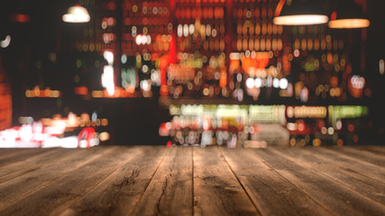 Fototapeta premium wooden table in front of abstract blurred background,3d rendering,conceptual image.