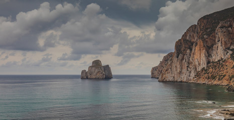 pan di zucchero rock, limestone formation in front of masua beach, south sardinia