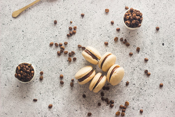 Macaroons. Delicious french desserts. Macaroons with coffee beans and chocolate. Macaroons on the table