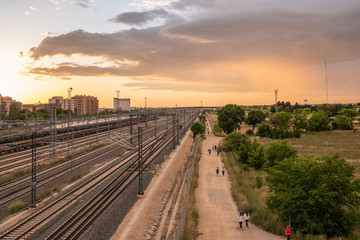 Fototapeta na wymiar The roads parallel to the tracks at sunset