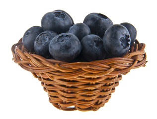 Blueberries in a basket isolated on white background.