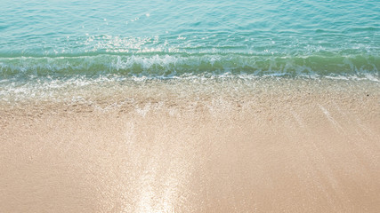 Blue ocean waves Sunlight Reflection Sand Beach background