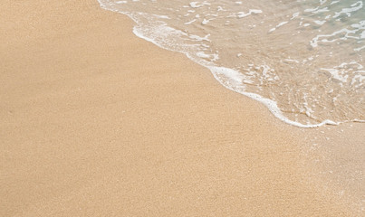 wave of blue ocean on sandy beach. texture Background.