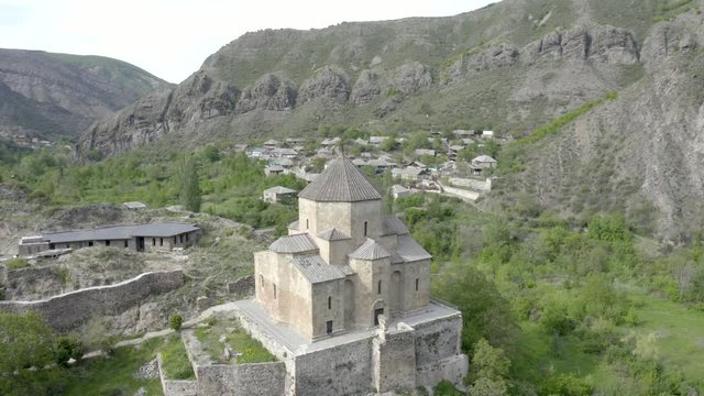 Beautiful Scenery At The Ancient Ateni Sioni Church And Tana Valley Near Gori, Shida Kartli, Georgia Surrounded In Mountain Landscape. - aerial orbit shot