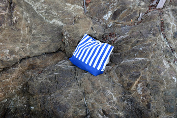 bright canvas bag on the stones
