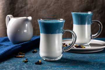 Blue matcha latte with milk. Fashionable Pea Butterfly Drink