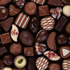 various chocolate candy and pralines, sweet food background