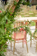 Fototapeta na wymiar Beautiful and rustic garden wedding setup on a sunny day during summer.