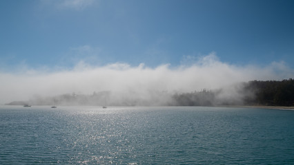 mist over Los Ojos bay and the sea