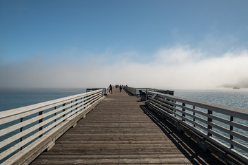 pier in the mist towards the sea