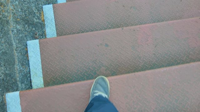 Walking down the stairs on a gray shoes in Japan