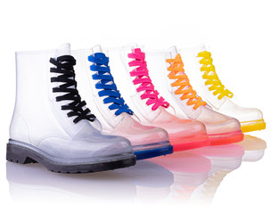rainbow colorful transparent rain boots isolated white background
