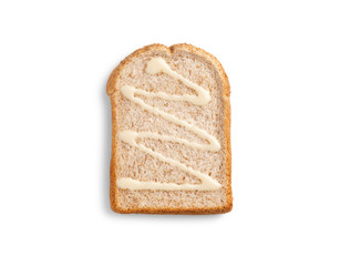 slice whole grain bread with sweetened condensed milk on white background