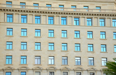 Symmetrical Windows on a Building Facade in Barcelona, Spain