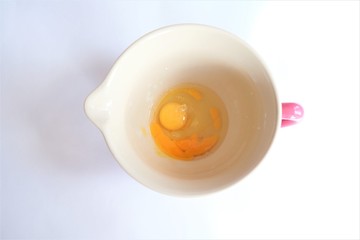 dough bowl and broken eggs - home cooking