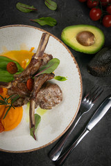 Grilled meat on a white plate in a top restaurant