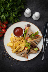 
American club sandwich with french fries