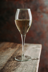 White wine on the rustic background. Selective focus. Shallow depth of field.
