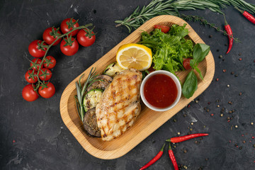 Grilled chicken with sauce, tomatoes and spices
