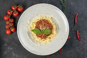 Italian pasta with cheese on a dark background

