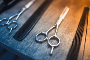 combs and scissors for haircuts lie on a shelf in the cabin