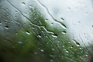 Rain on car front window. close up