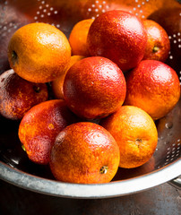 Ripe bloody oranges on the rustic background. Selective focus. Shallow depth of field.