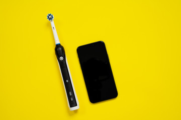 Modern electric toothbrush with replacement head and ability to automatically control and check...