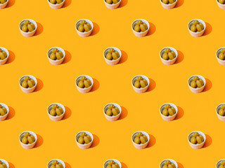olives in bowls on orange colorful background, seamless pattern