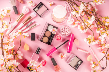 Obraz na płótnie Canvas Makeup products with spring flowers