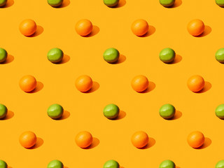 ripe oranges and limes on colorful background, seamless pattern