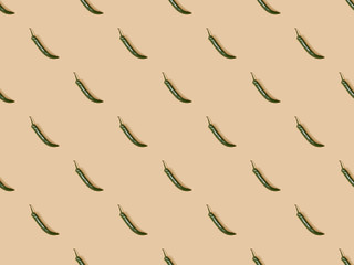 top view of jalapenos on beige background, seamless pattern
