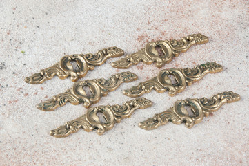 Six antique brass keyholes lock covers